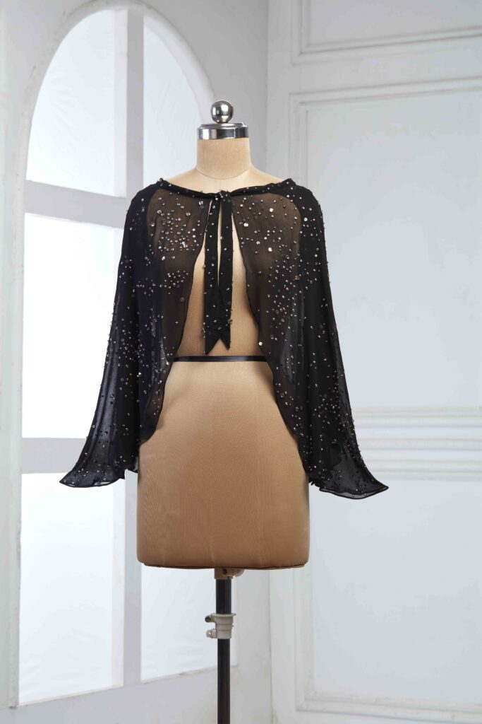 starveil cape displayed on a maniquine